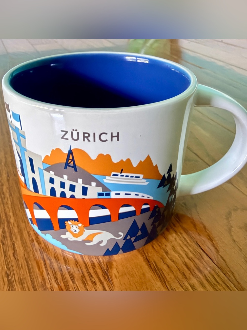 Starbucks Zürich City Mug — White Exterior, Blue Interior with Orange & Gray Art